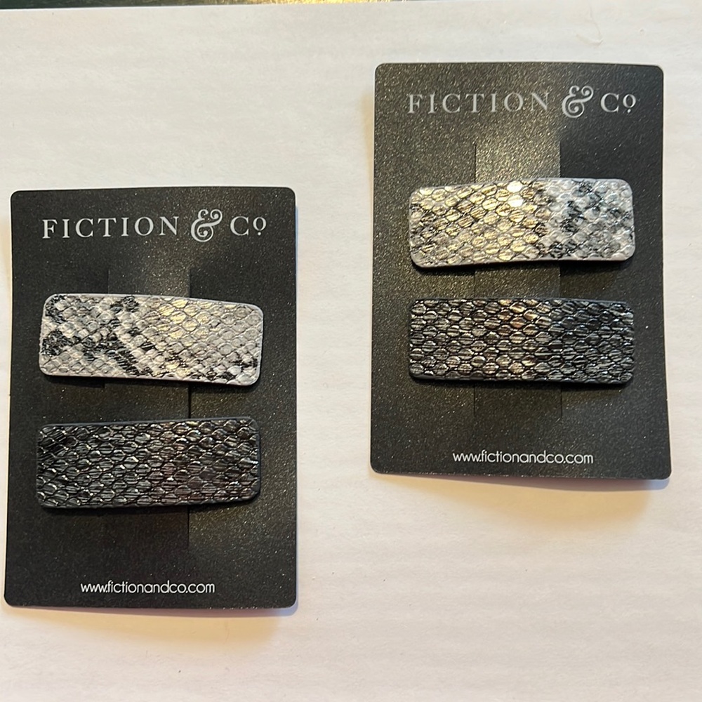 Metallic snake clips. New. 3 sets available.
